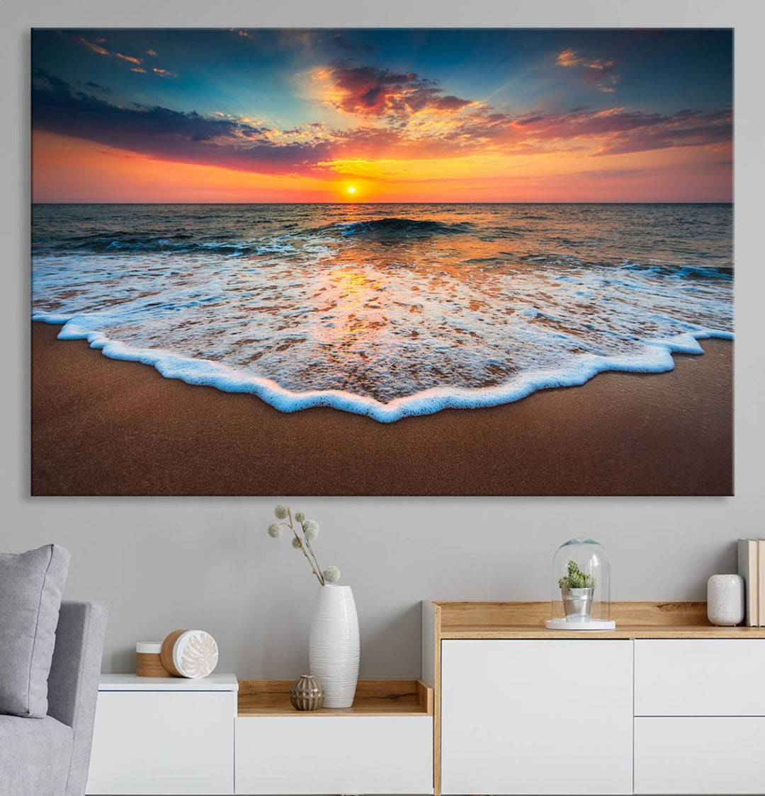 A Sunset with Calm Waves on the Beach Wall Art Canvas Print adorns the dining room.