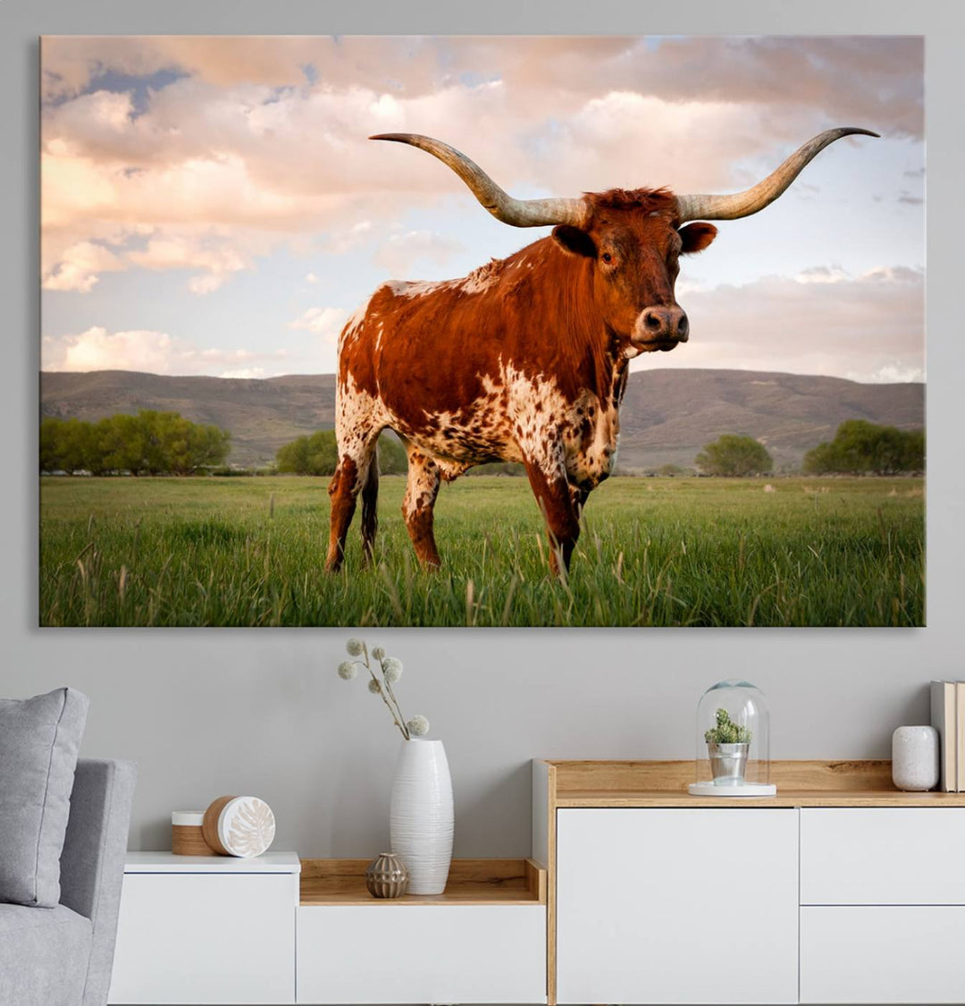 The Texas Cow Canvas Wall Art print captures a longhorn cow at sunset and is ready to hang.