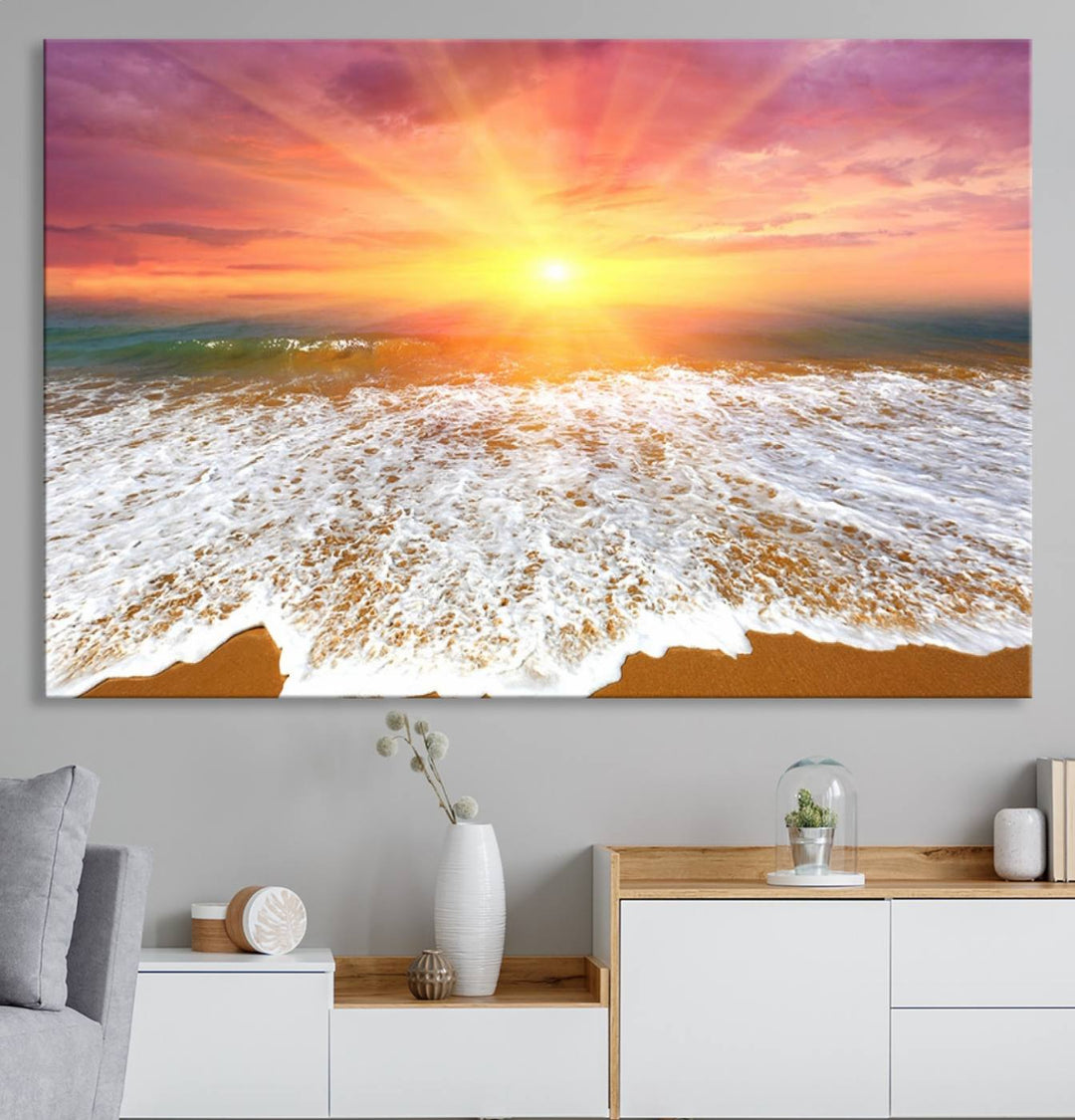 Golden Beach Sunrise 3-panel canvas art of ocean waves, hung on a wooden wall.