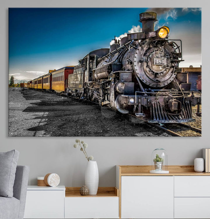 The Train Wall Art Canvas Print features a vintage steam train with a bright headlight.