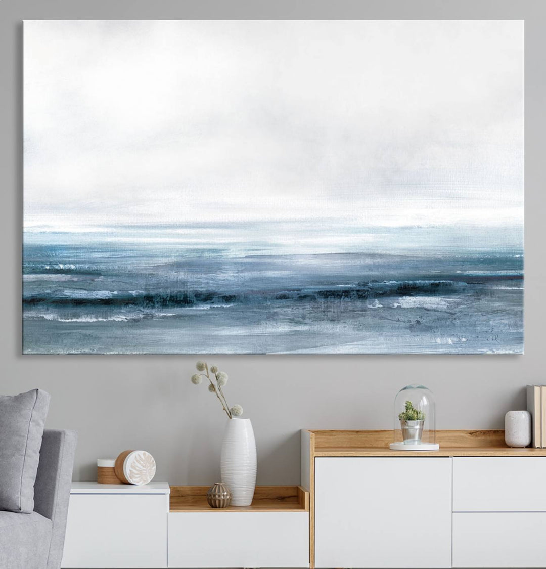 The dining area features Blue Ocean Abstract Artwork on canvas.