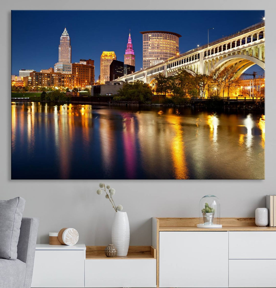 Cleveland Night Skyline Canvas: Cityscape with an illuminated bridge reflecting on calm water.