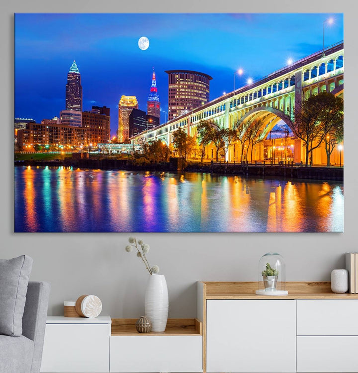 A Cleveland Night Skyline Wall Art on museum-quality canvas showcases a bridge and illuminated buildings.