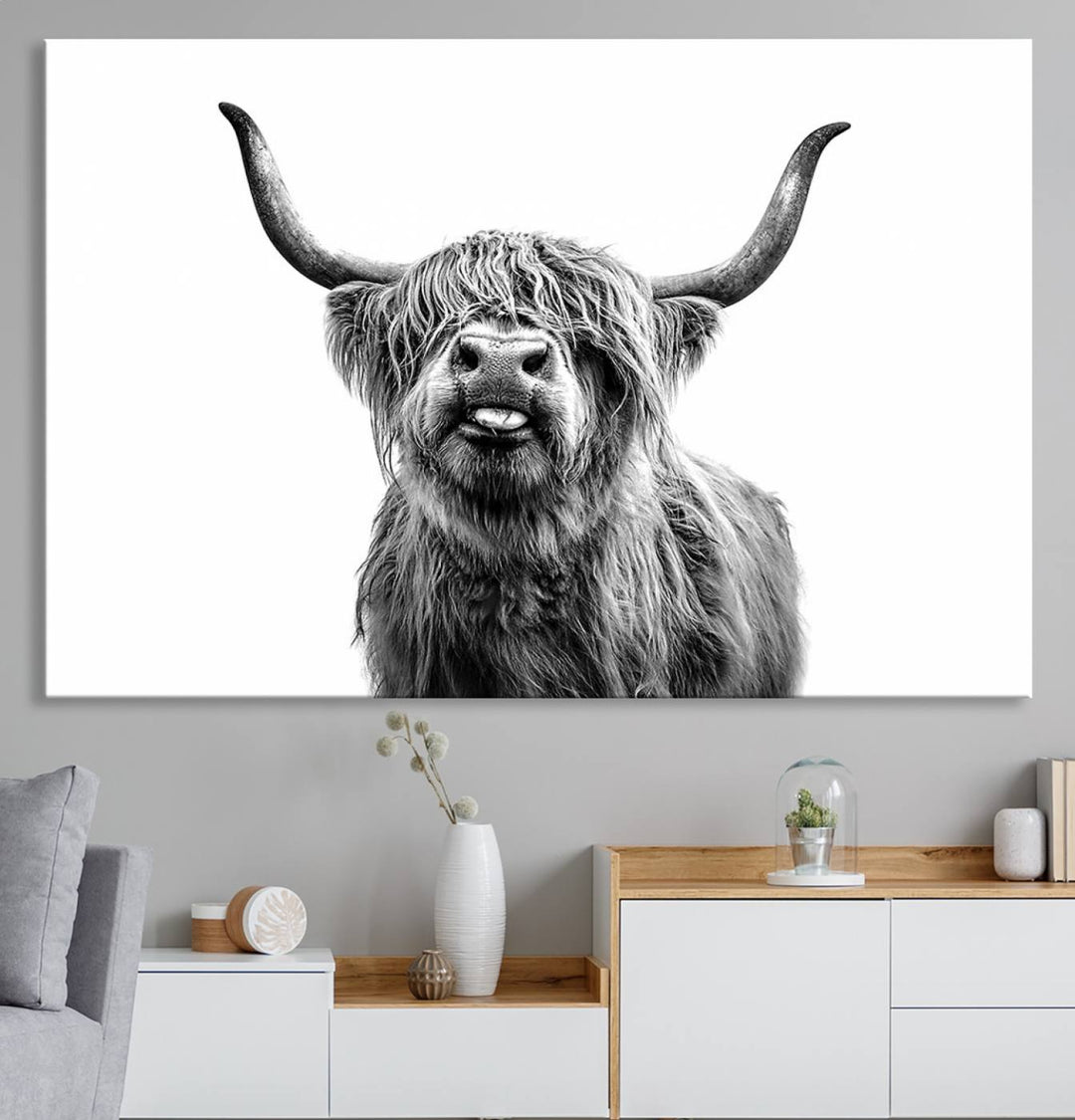 The Fanny Highland Cow art print decorates the modern kitchen, featured in black and white.