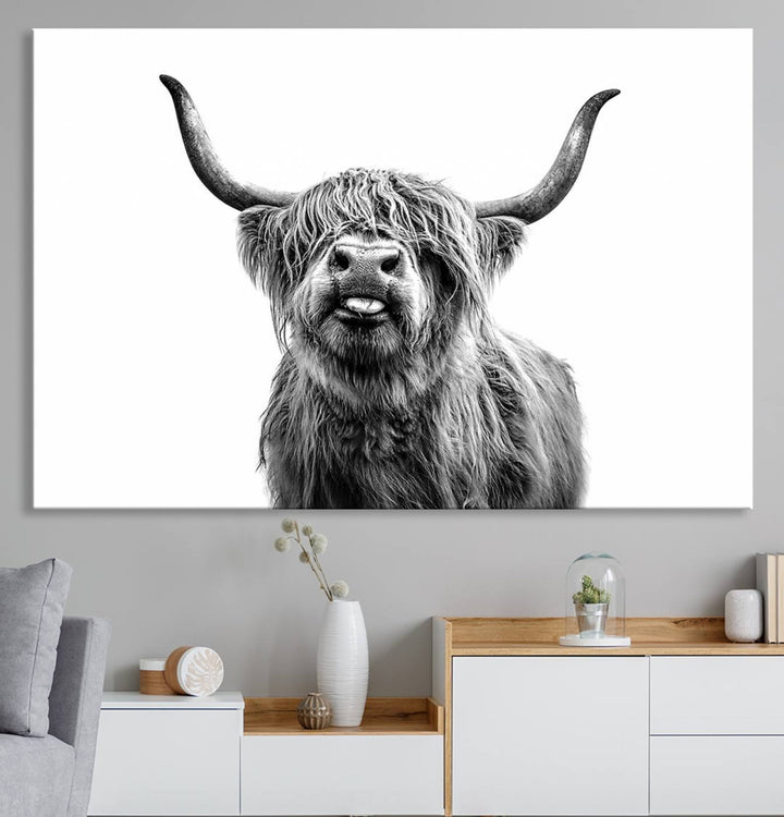 The Fanny Highland Cow art print decorates the modern kitchen, featured in black and white.