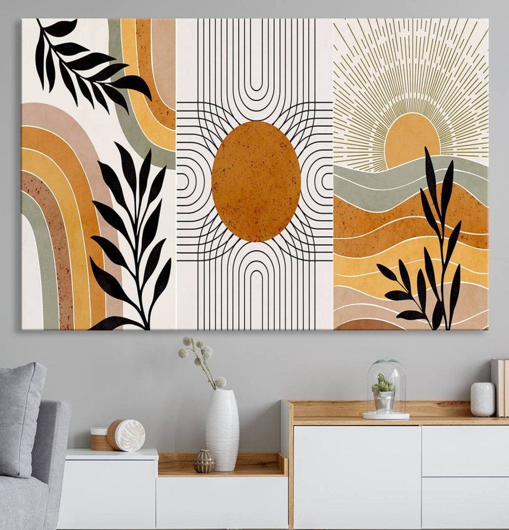 The Modern Boho Sun and Leaf giclée canvas is a 3-panel piece designed for mid-century or bohemian decor.