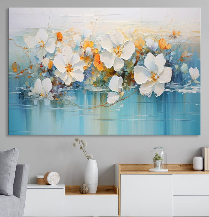 An Abstract Flower Wall Art Canvas Print in blue and orange hues.