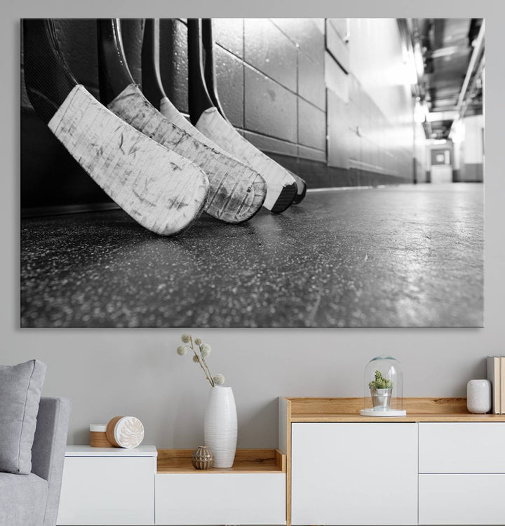 Ice Hockey Wall Art Canvas Print features a UV-protected black and white photo of hockey sticks.