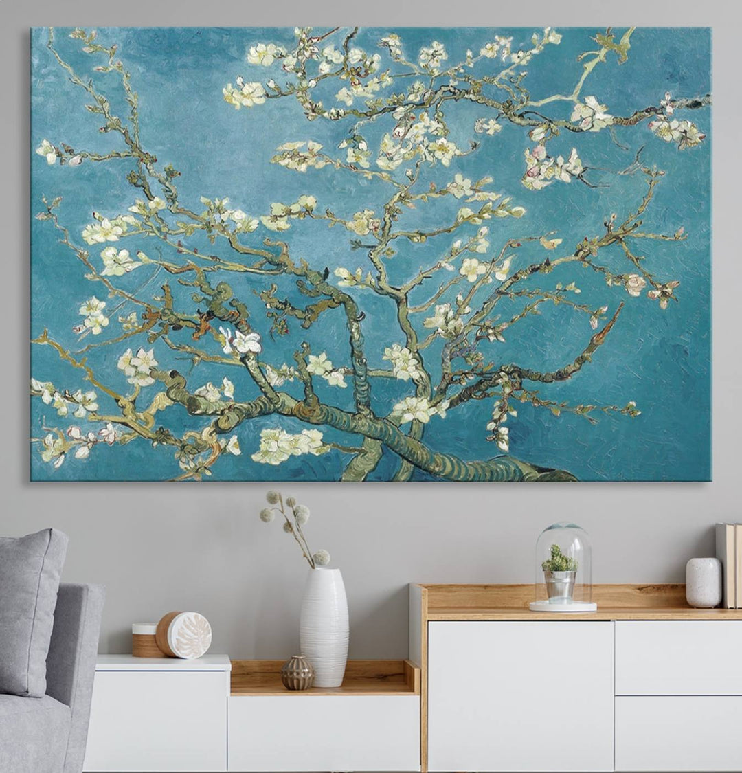 The wall art, Vincent Van Goghs Almond Blossom, stands out with its vibrant depiction against a serene blue background.