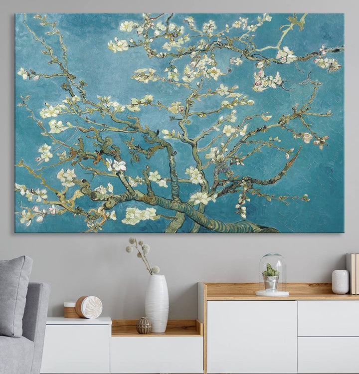 The wall art, Vincent Van Goghs Almond Blossom, stands out with its vibrant depiction against a serene blue background.