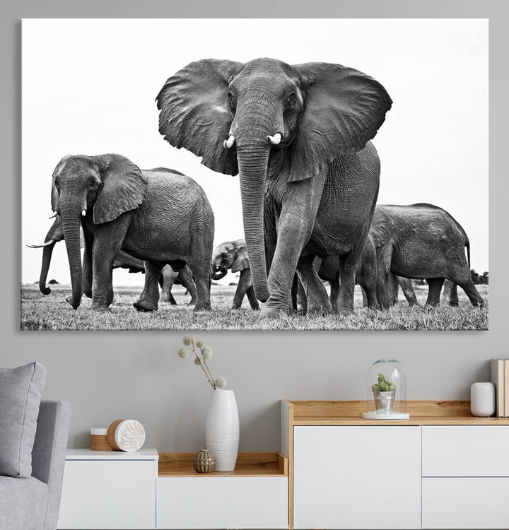 A modern dining area features a Black White Elephant Family Wall Art Canvas Print.