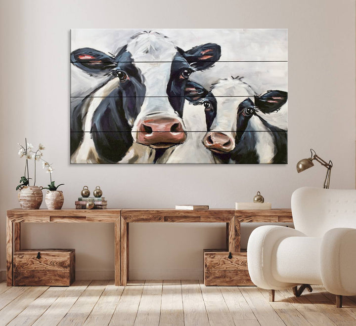 The Vintage Baby and Mom Cattle Canvas, featuring cows with black and white patches, is a prominent piece of wall art.