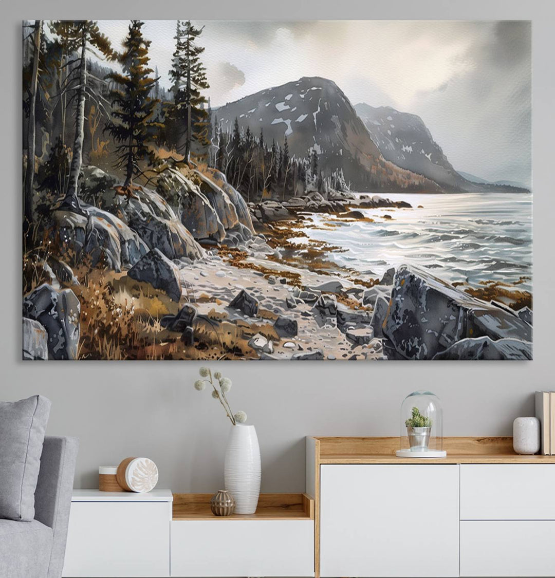 Framed wall art depicting Acadia National Parks rocky coast, trees, mountains, and sunlight over the sea; ready to hang.