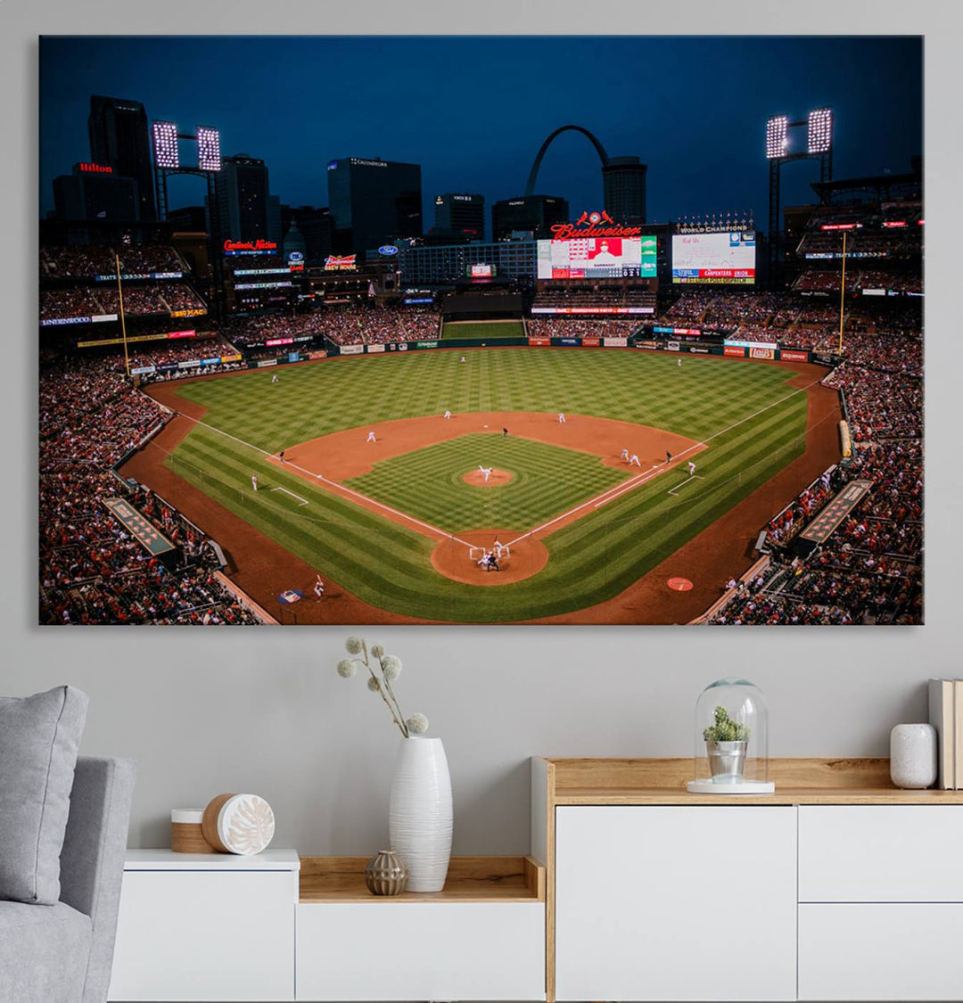 A St. Louis Cardinals Baseball Team print of Busch Stadium at night adorns the wall.