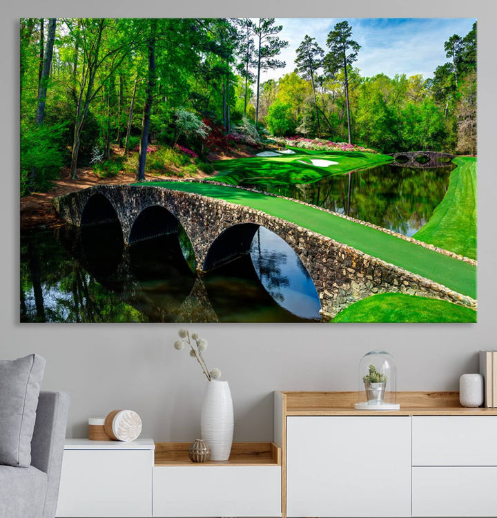 The wall art from Augusta National Golf Club showcases a panoramic bridge set against rich, lush greenery on a framed triptych canvas.