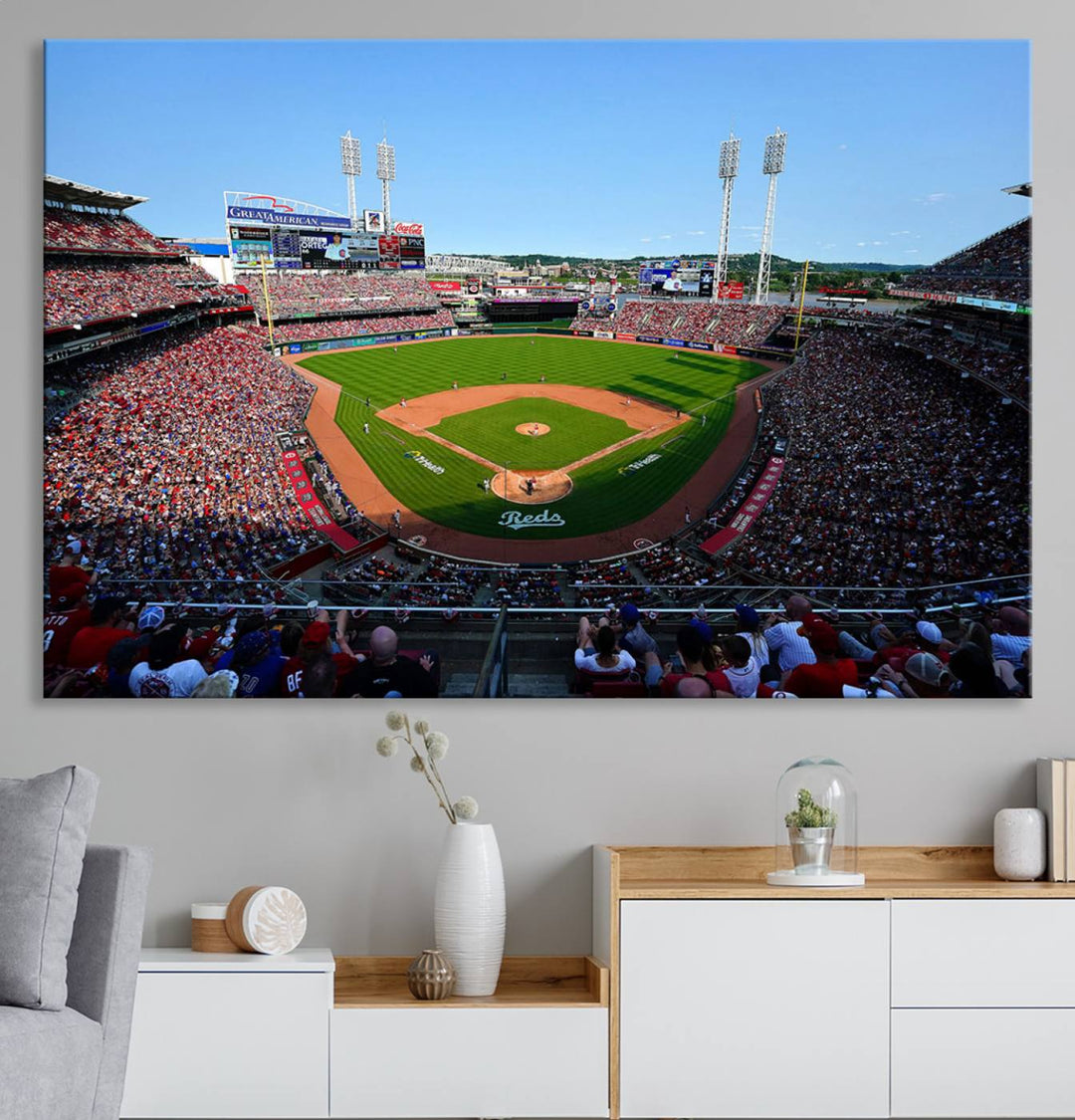 The Cincinnati Reds Baseball Team print of Great American Ball Park Stadium adorns the wall.