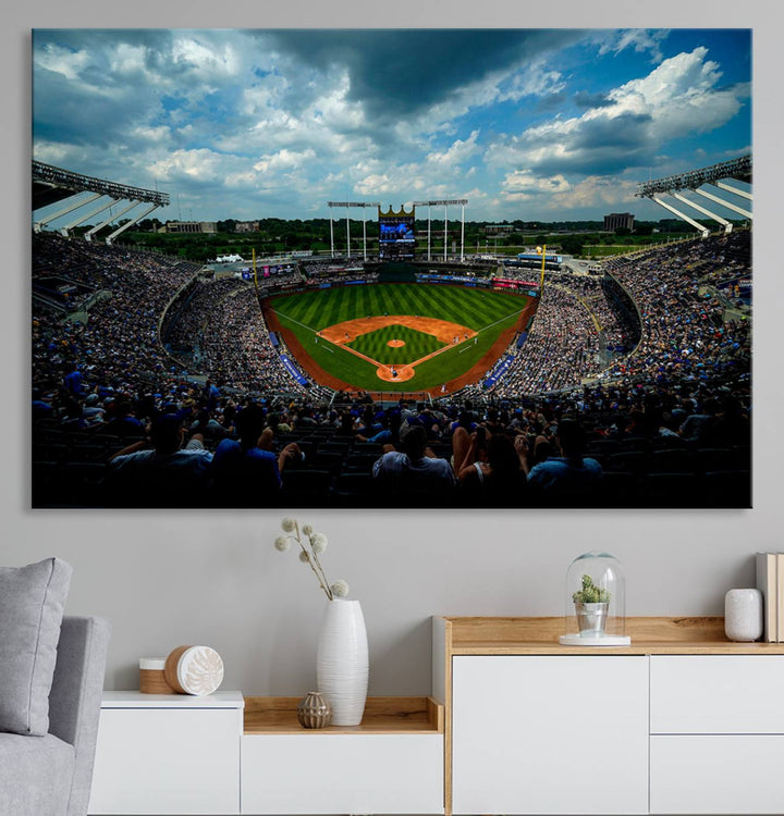 A 3-panel print of Kauffman Stadium, showcasing a crowded baseball field under cloudy skies.