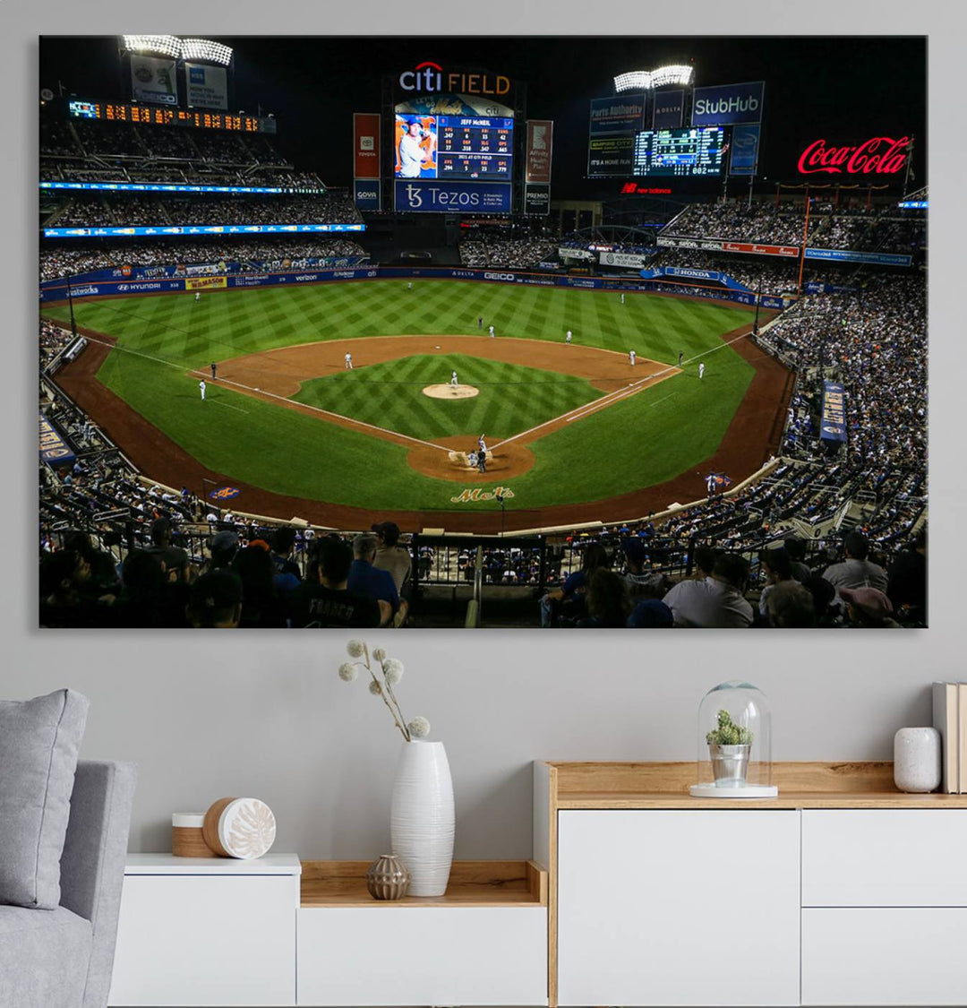 A print of the Oakland Athletics game at RingCentral Coliseum hangs on the wall.