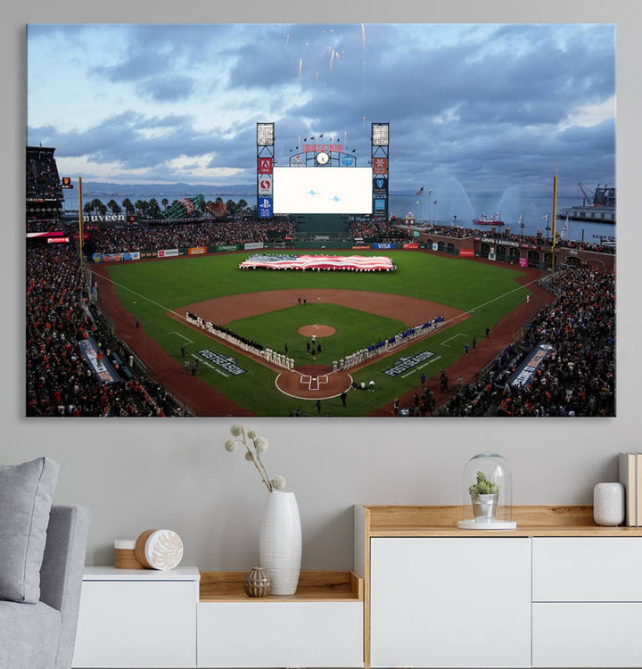 This framed 3-panel canvas MLB wall art features a giant flag and fans under a cloudy sky at Oracle Park.