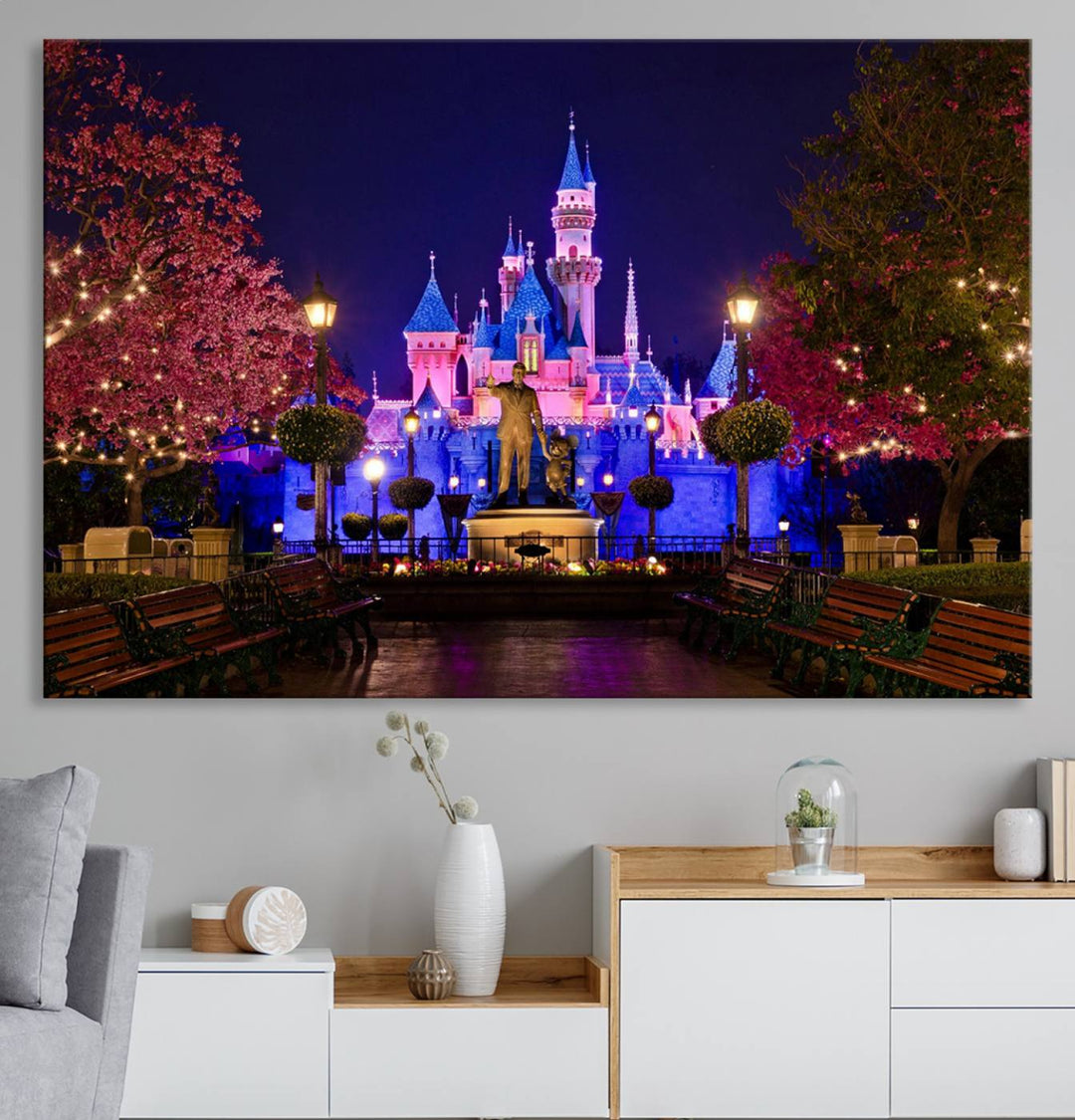 The Castle Large Wall Art is surrounded by illuminated trees at night.