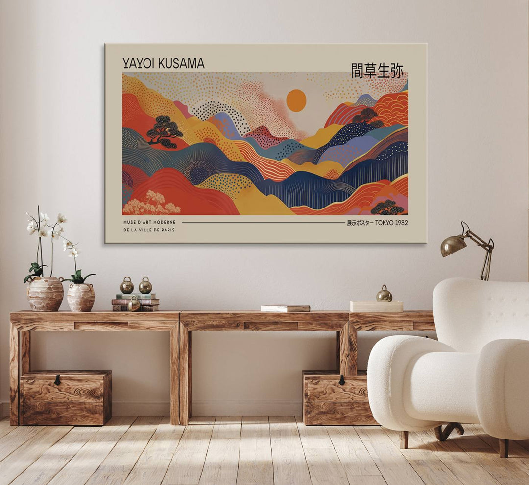 The Yayoi Kusama vibrant landscape canvas print featuring abstract mountains and a sun enhances the space with its modern aesthetic.