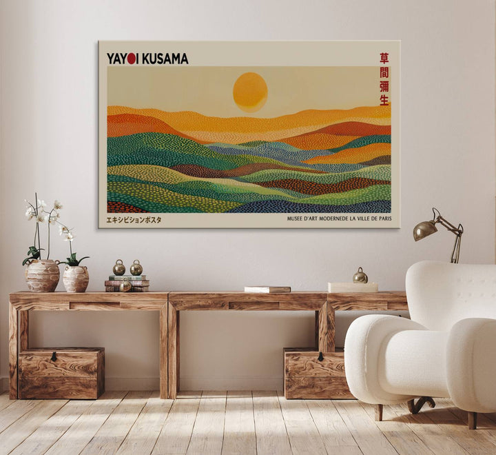 A framed Yayoi Kusama 1986 wall art print showcases a vibrant abstract landscape with colorful, wavy dots and a sun above the horizon.