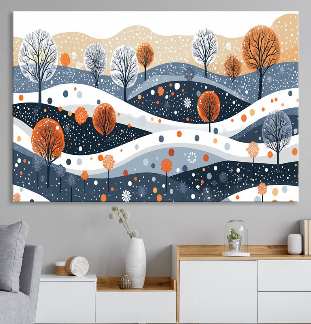 The "Abstract Winter Landscape Canvas Wall Art Print," featuring a triptych of landscapes with trees and hills in vibrant orange, white, and blue hues, adds a gallery-quality finish that transforms the space into an art lover's dream.