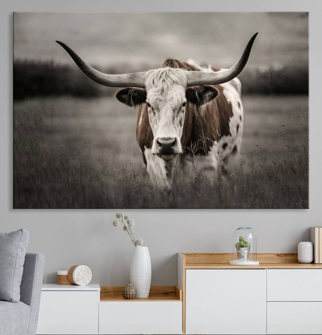 The Texas Longhorn Cow Canvas Wall Art Print adds a rustic touch to a living room.