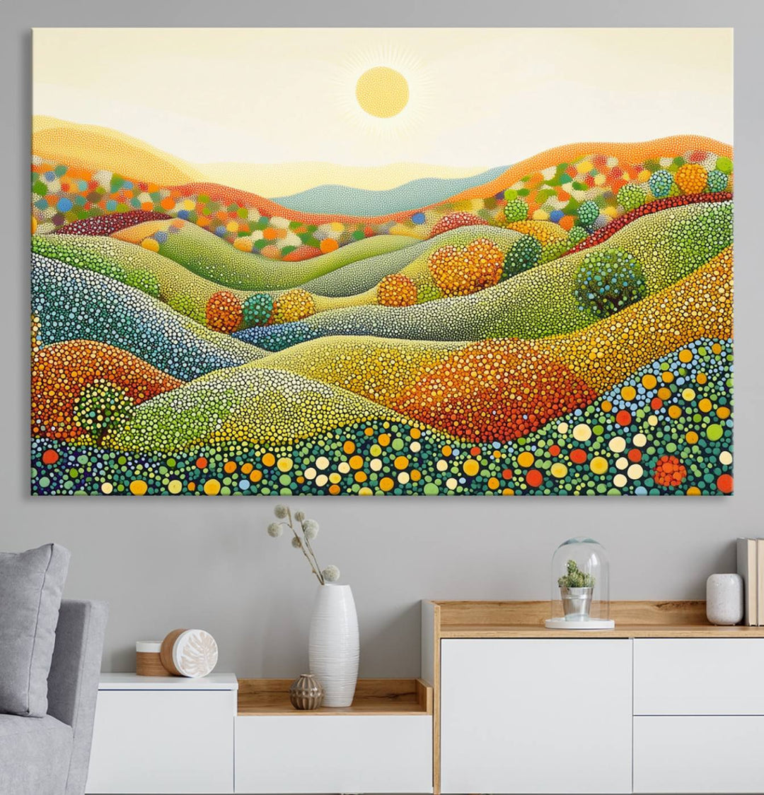 The YAYOI KUSAMA Colorful Dot Art Landscape Canvas, a framed abstract pointillism piece inspired by nature featuring vibrant rolling hills and a sun, adds gallery-quality elegance to your living space.