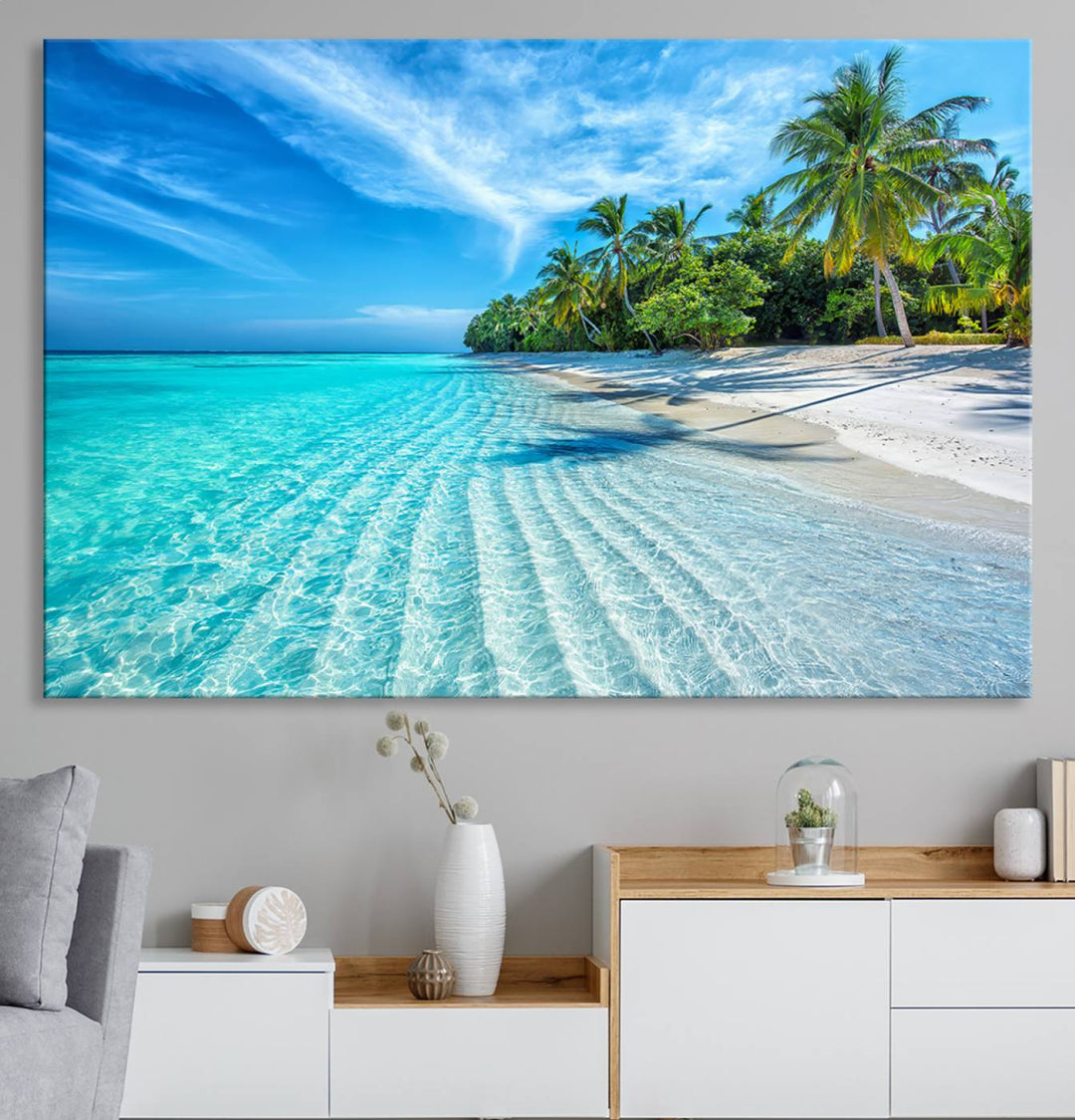 The Tropical Beach Wall Art Canvas Print showcases a serene ocean landscape with crystal clear turquoise water and palm trees, beautifully enhancing the coastal decor.