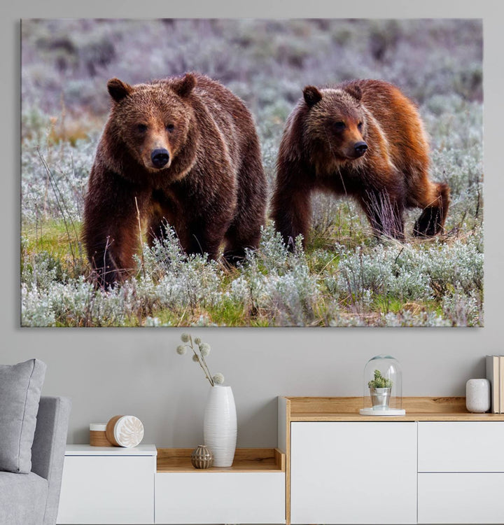 The "Grizzly 399 in Wild Flowers" wall art canvas print, showcasing grizzly bears amidst vibrant wildflowers, elegantly captures the enchanting essence of nature. This handmade piece from the USA brings striking beauty to any space.