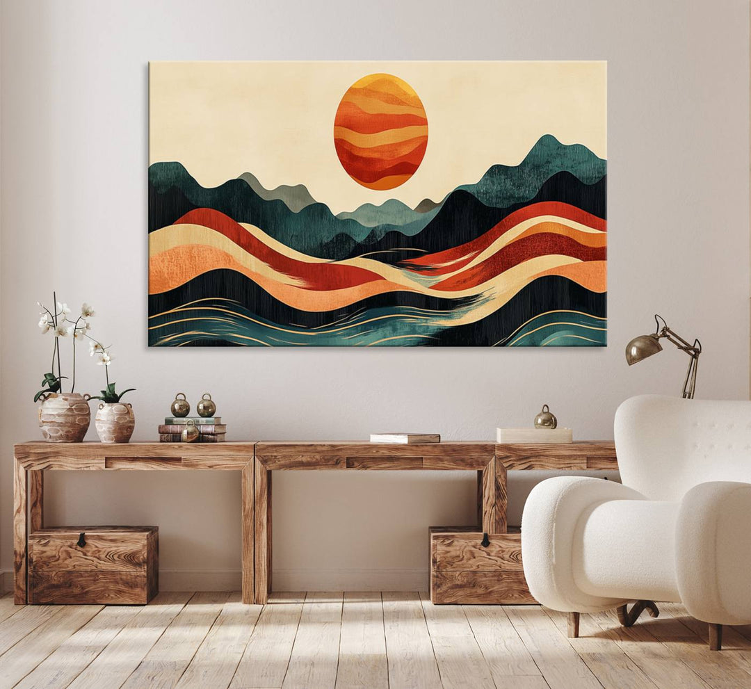 The Mountain Triptych wall art, featuring a design of the sun, mountains, and waves, is displayed prominently on the wall.