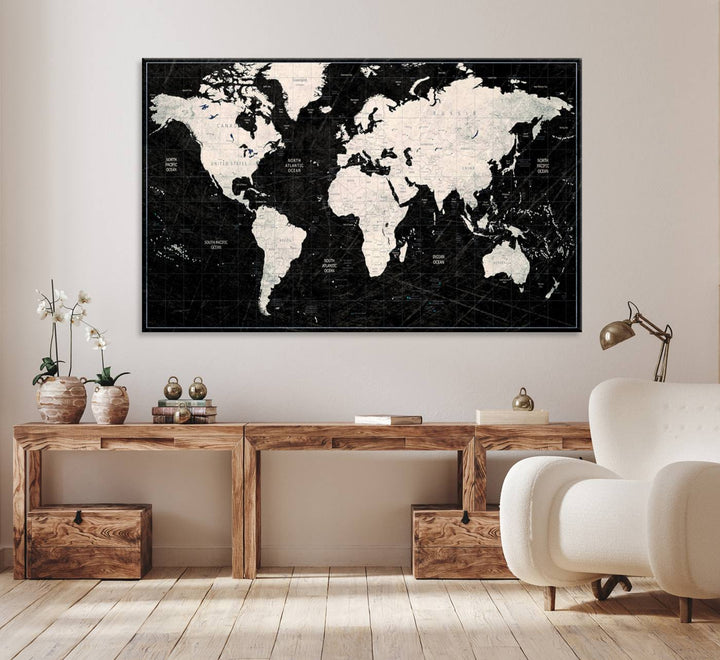 The Black & White World Map Canvas Wall Art, a giclee print, elegantly decorates the wall.