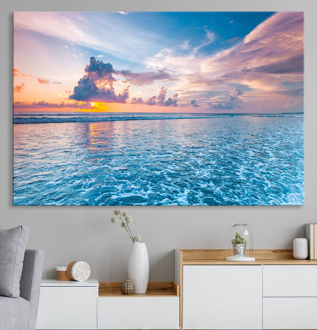 An Ocean Sunset Canvas Wall Art depicting a vibrant sky and rolling waves.