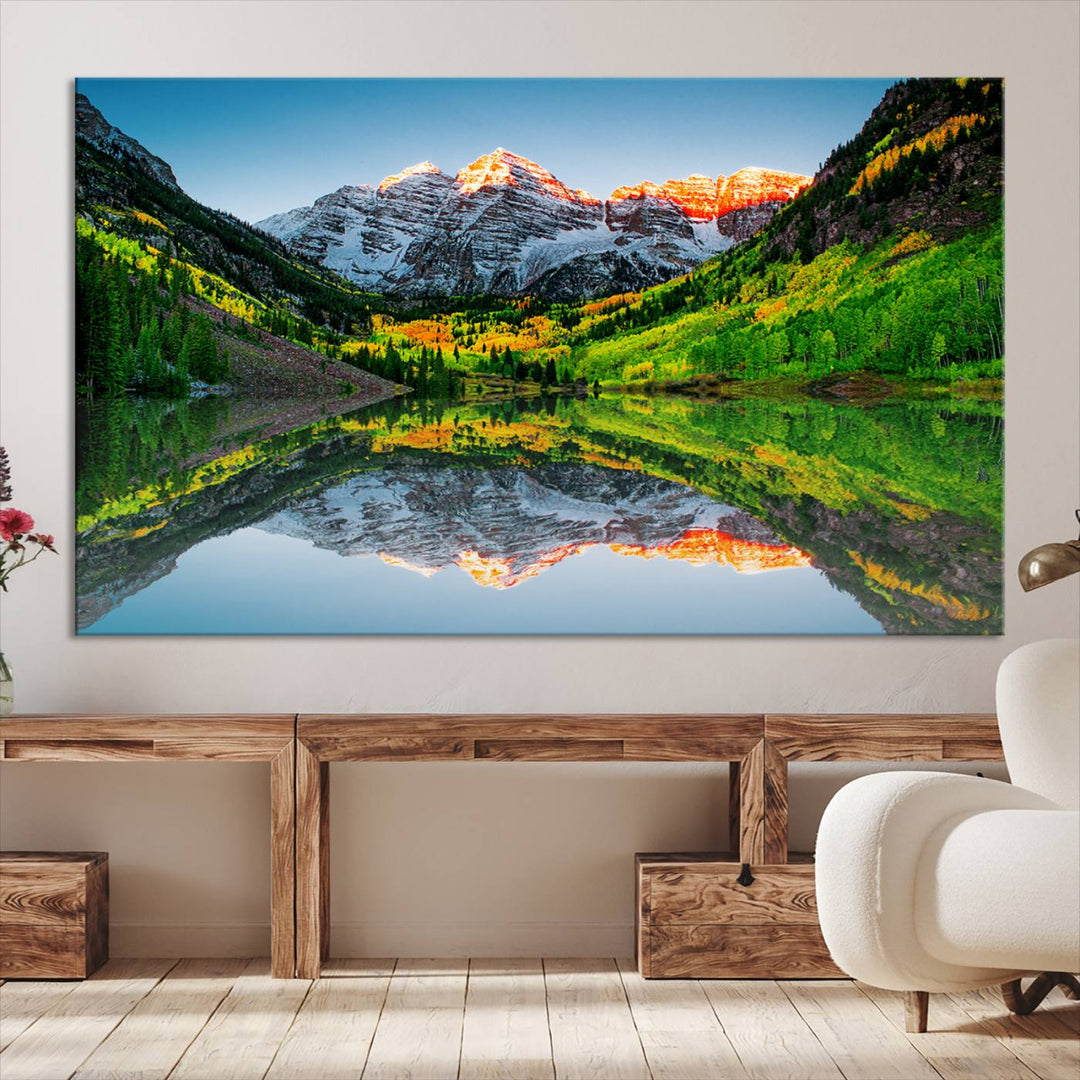 The Sunrise Maroon Bells Lake Wall Art Print beautifully captures North Maroon Peak mirrored in the tranquil lake, framed by lush greenery.