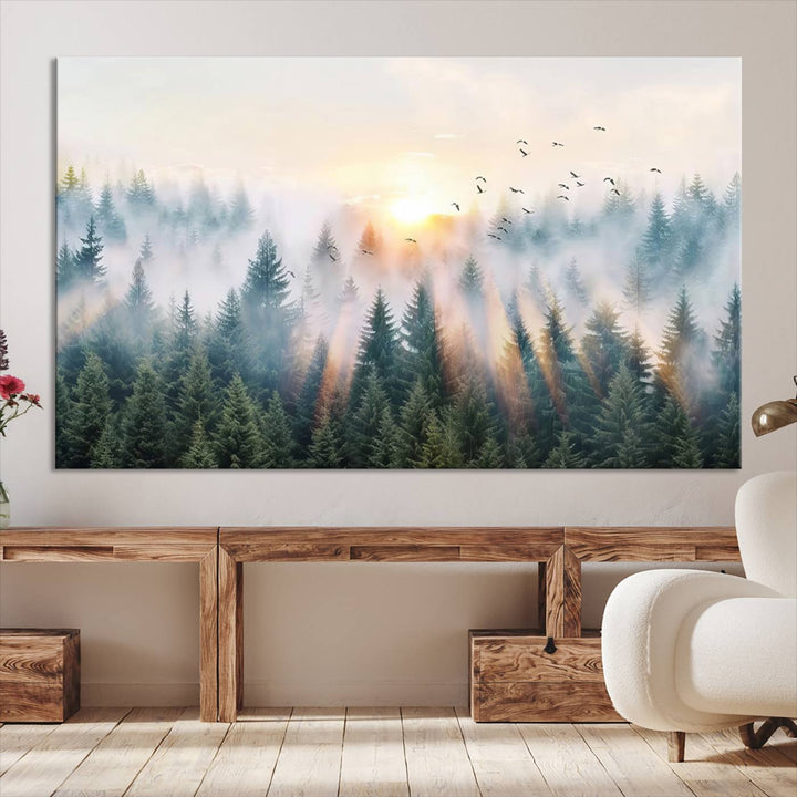 Misty Pine Forest Wall Art: A depiction of sunrise over foggy trees and birds against a bright sky; a framed woodland scene ideal for home or office decor.