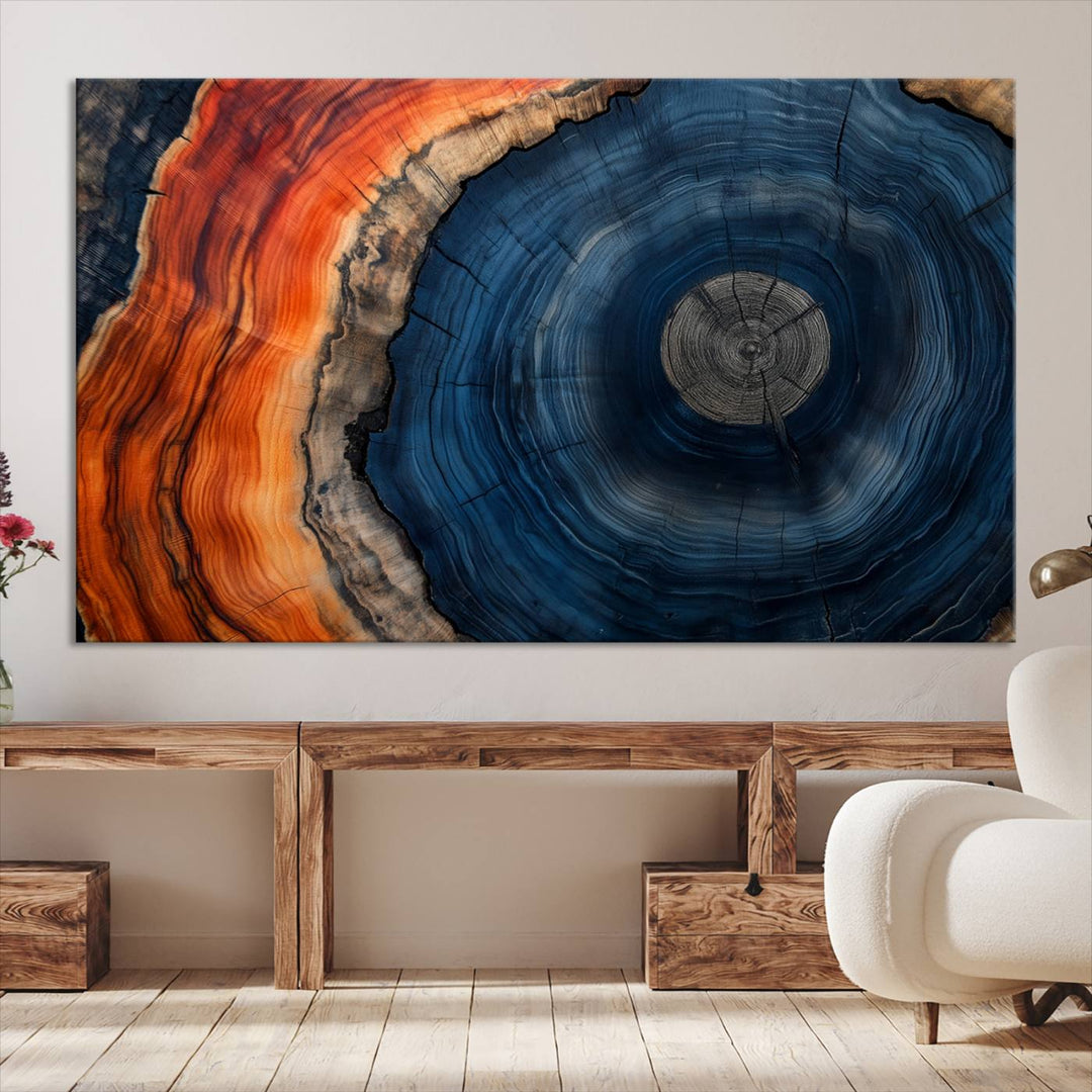 Abstract Tree Ring Wall Art Print on canvas featuring vibrant blue, orange, and brown rings with a natural rustic wood texture. Free shipping available!.