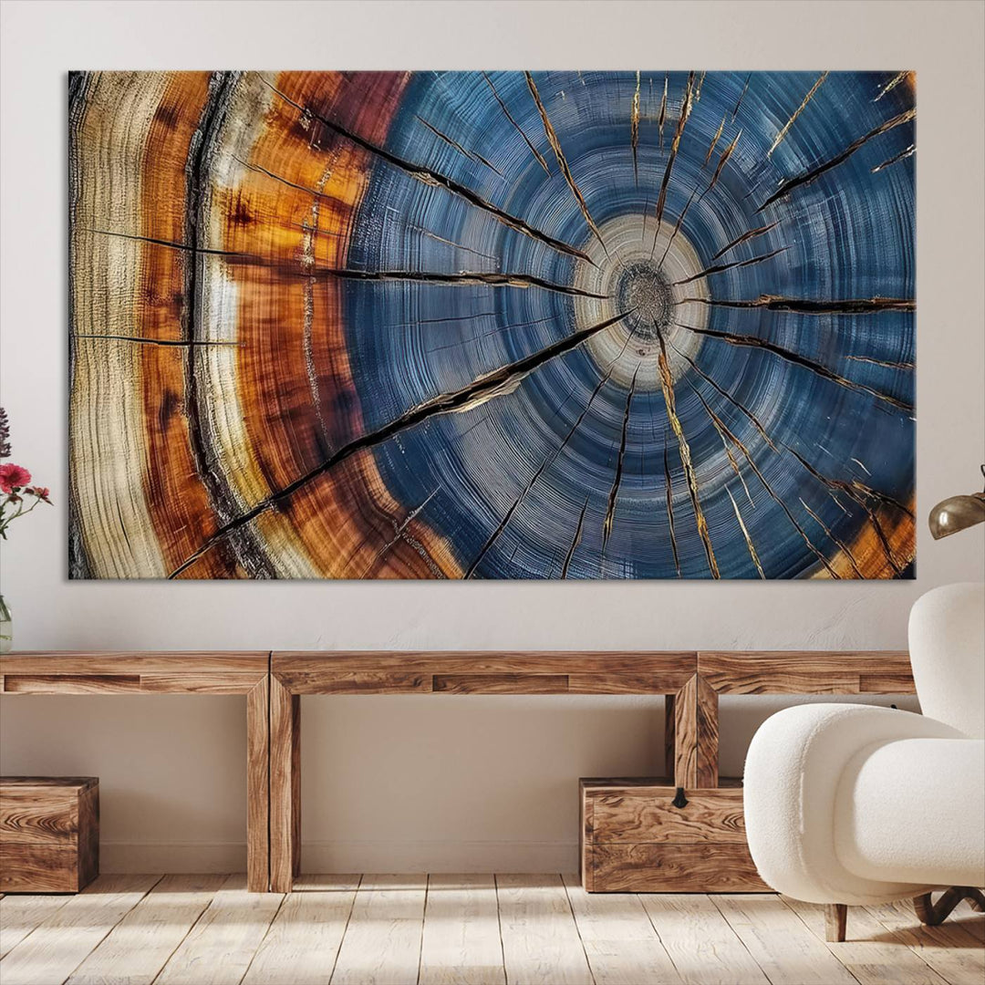 Close-up of blue, brown, and orange wood grain rings on the Abstract Tree Rings Canvas Wall Art Print.