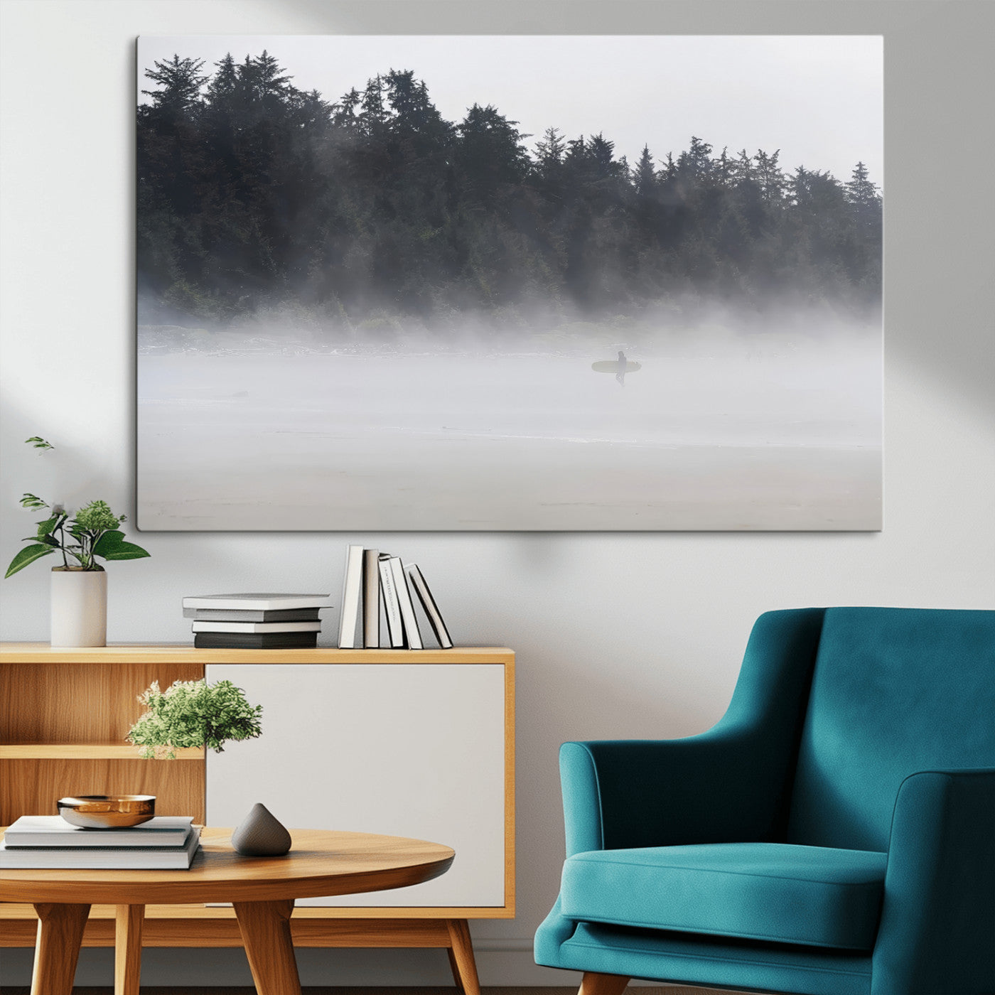 A lone surfer carrying a board through a misty shoreline, surrounded by dense trees and fog, creating a peaceful and mysterious coastal scene.