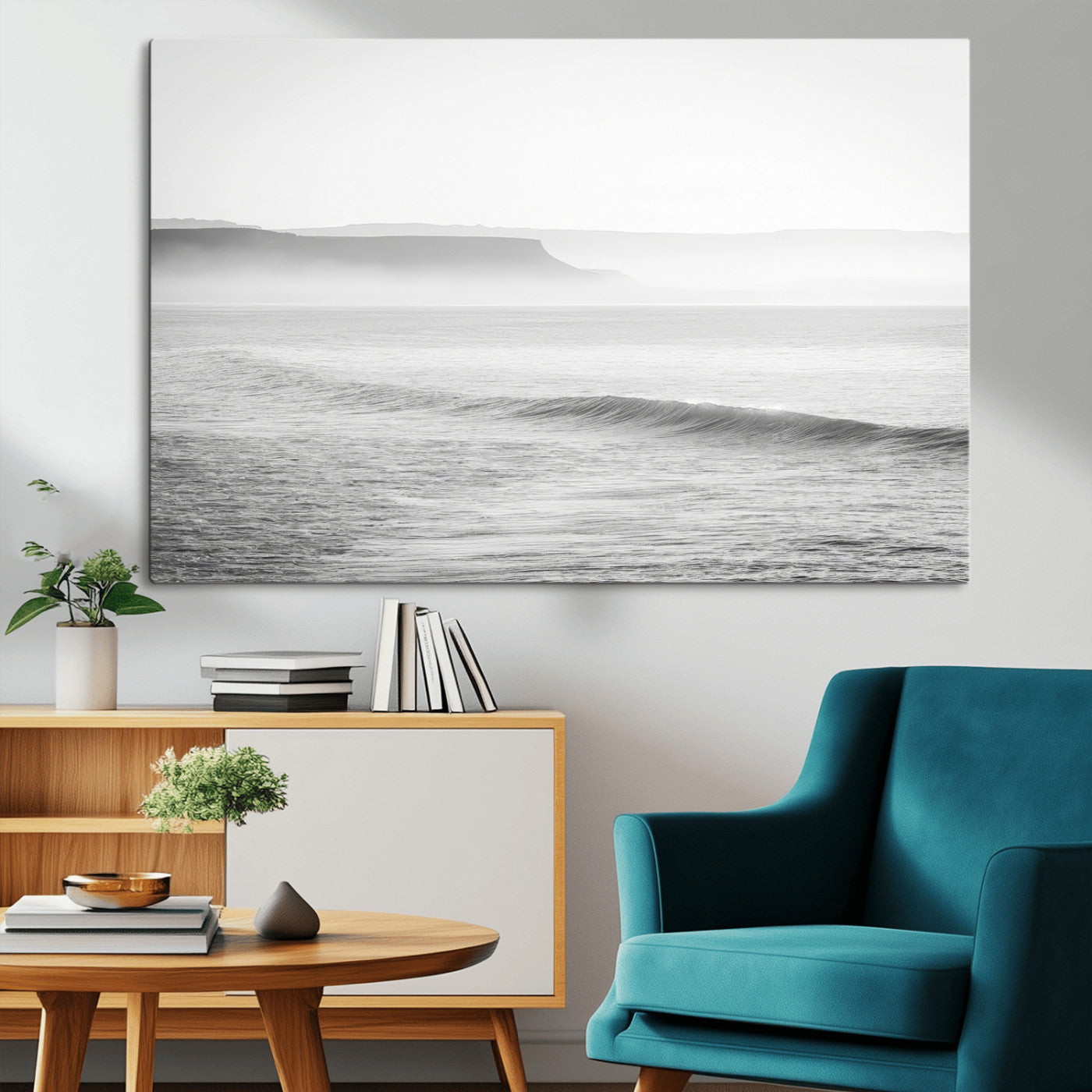 A black and white minimalist seascape featuring soft rolling waves and misty distant cliffs, creating a serene and timeless coastal atmosphere.