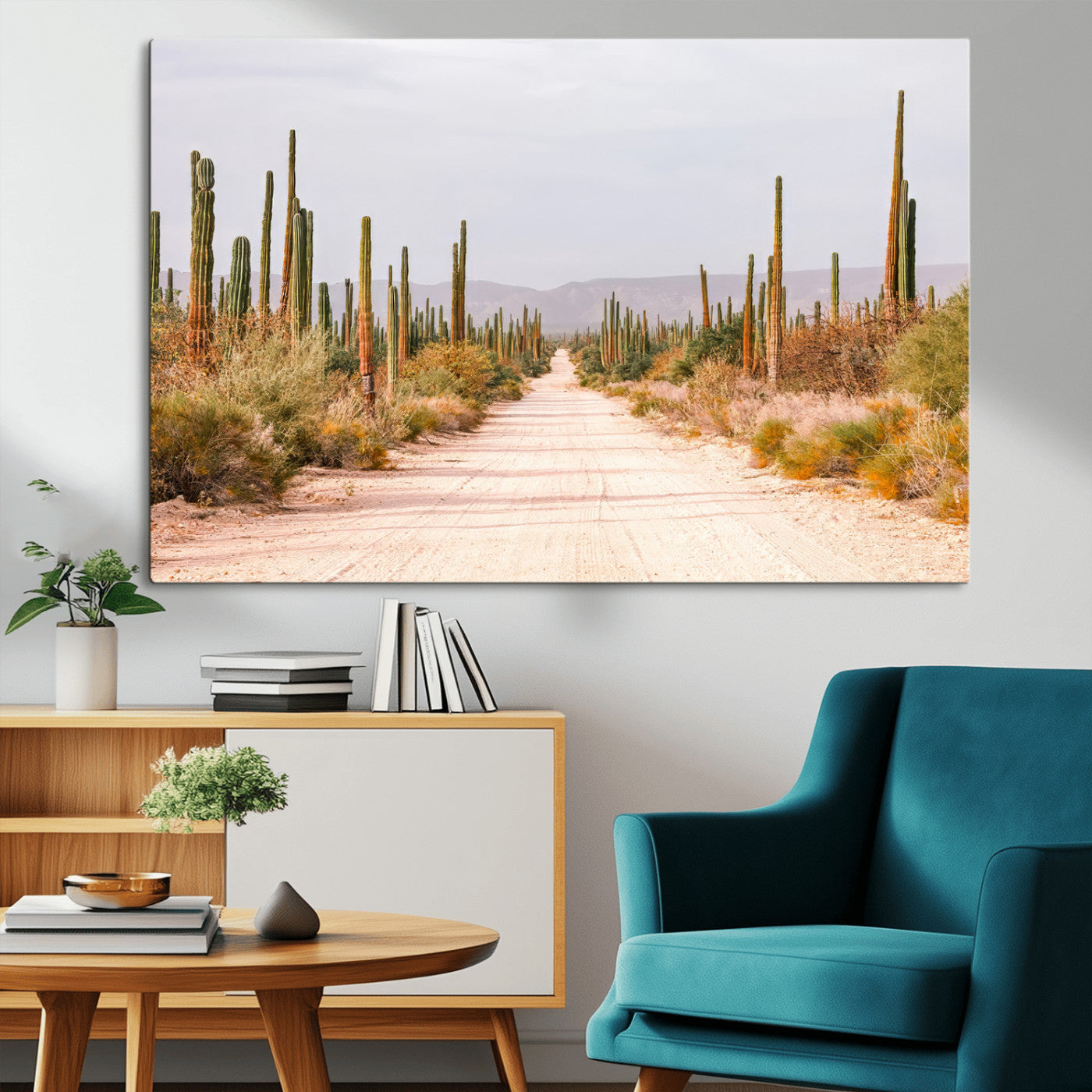 A desert road lined with saguaro cacti under a golden sky, creating a warm southwestern feel, perfect for boho or rustic decor.