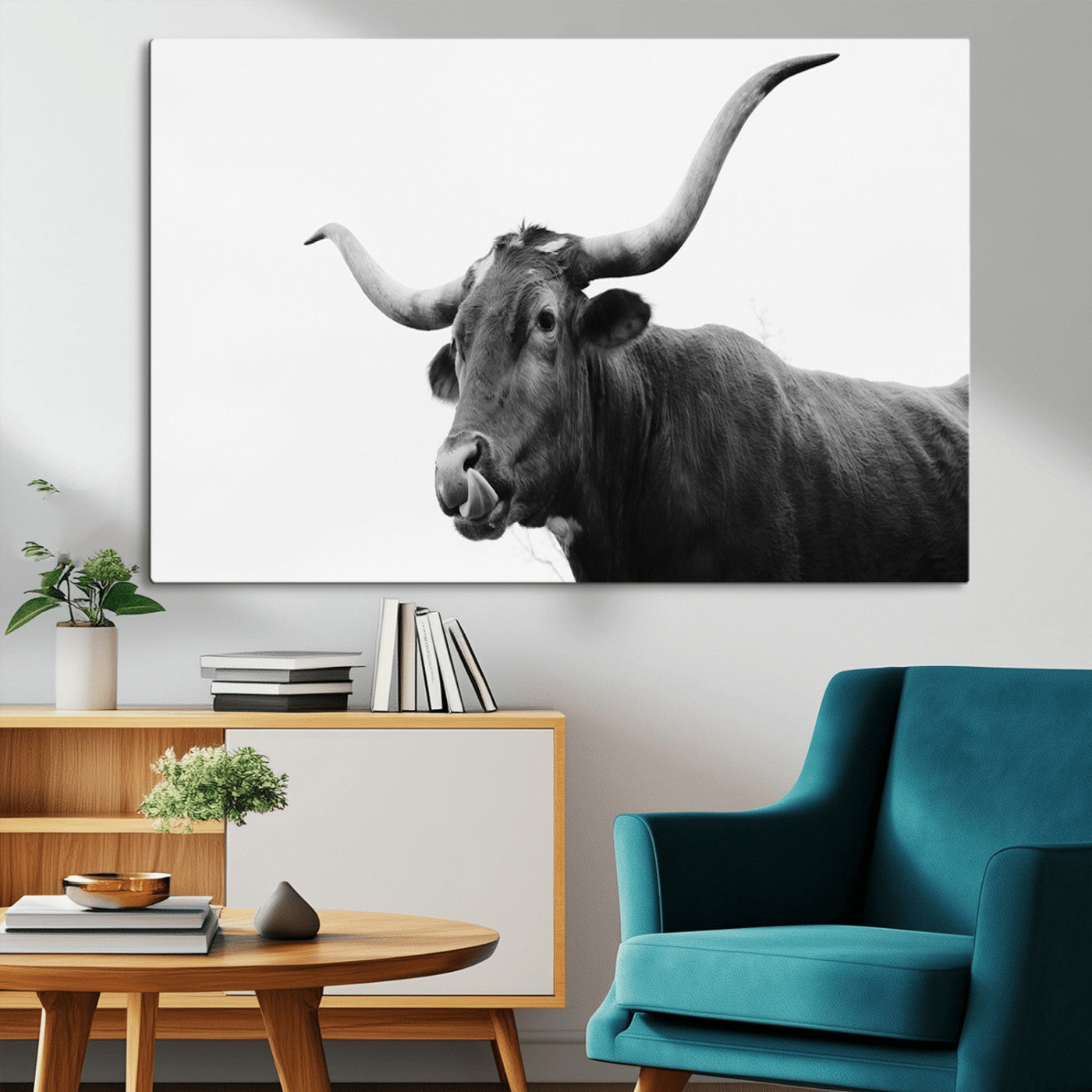 Black and white photo of a Texas Longhorn cow with curved horns, ideal for rustic, western or minimalist style home decor.