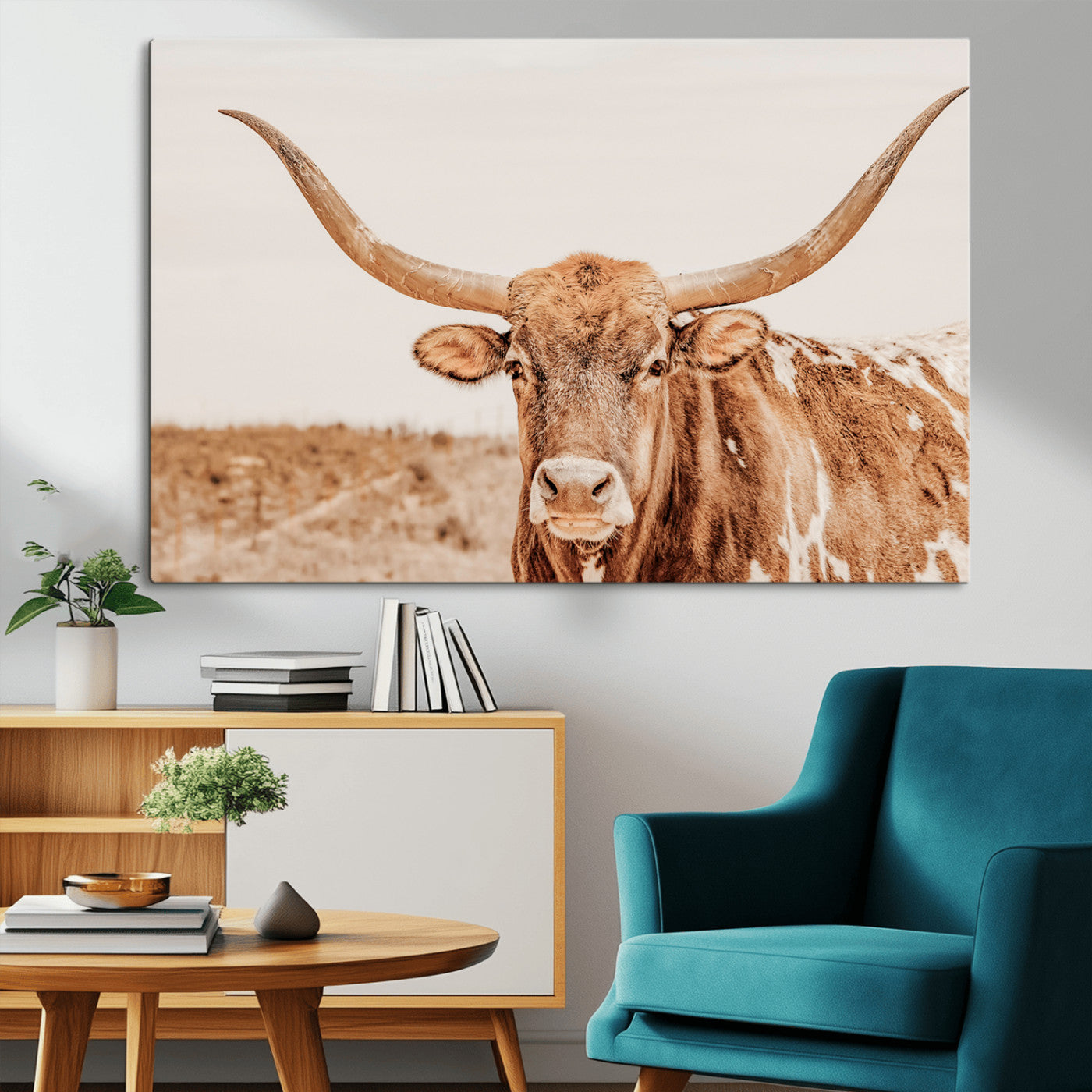 Sepia-toned Texas Longhorn facing forward in a dry field, perfect for rustic farmhouse or western-themed neutral home decor.