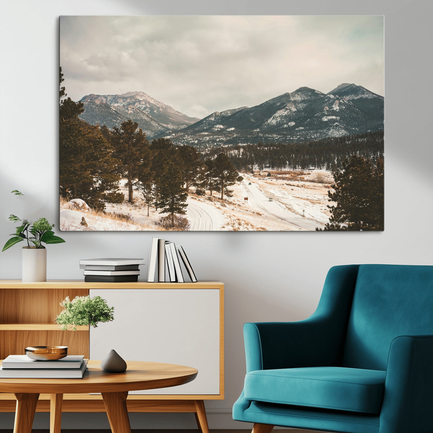 Snow-covered mountains with pine trees and a winding path, creating a serene and rustic winter landscape perfect for cozy decor.