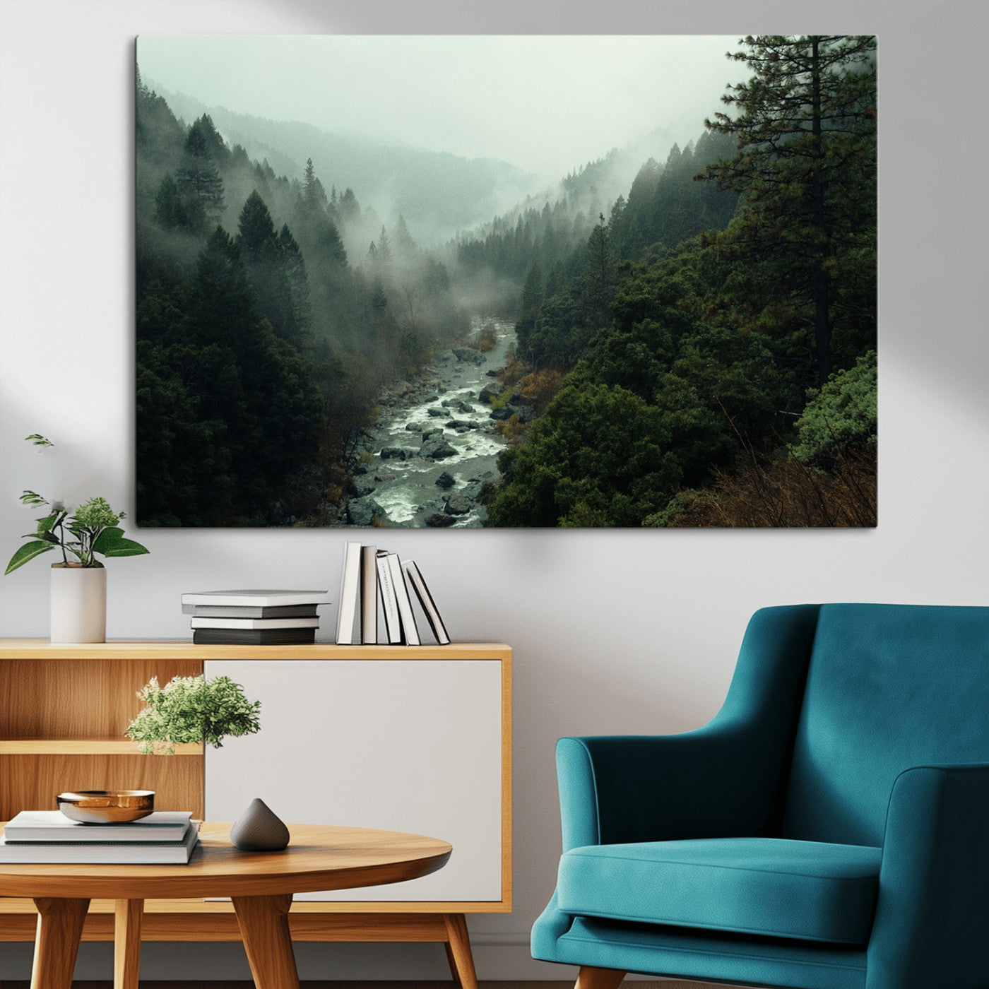 Misty forest with a winding river flowing through lush green mountains, creating a tranquil and moody wilderness landscape.