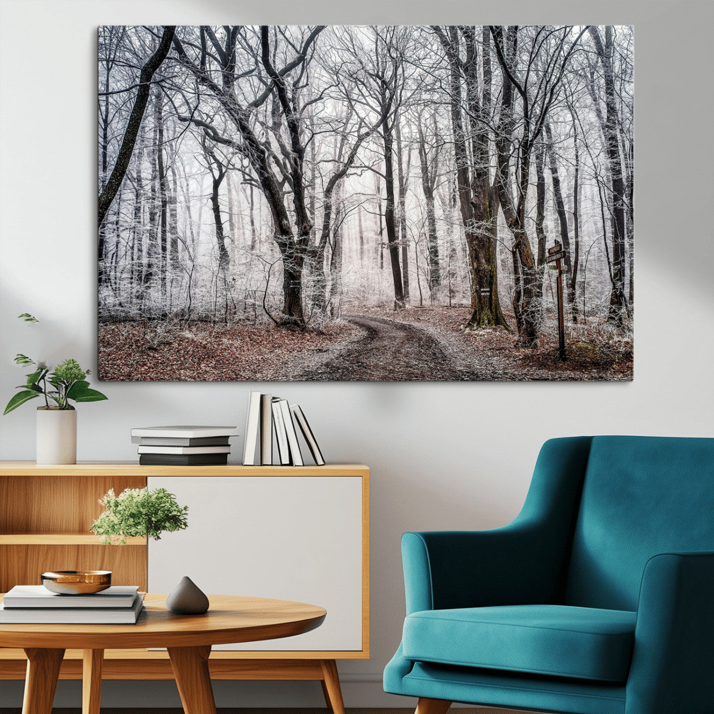 Snow-covered trees in a misty winter forest with a winding path, creating a serene and mysterious atmosphere, perfect for nature-inspired wall art.