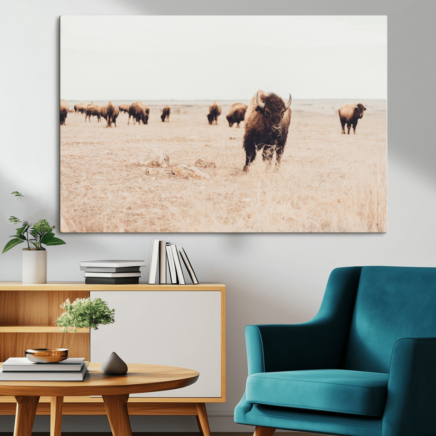 Herd of bison roaming a vast prairie with golden grass under a soft sky, creating a rustic and Western landscape, ideal for wall art.