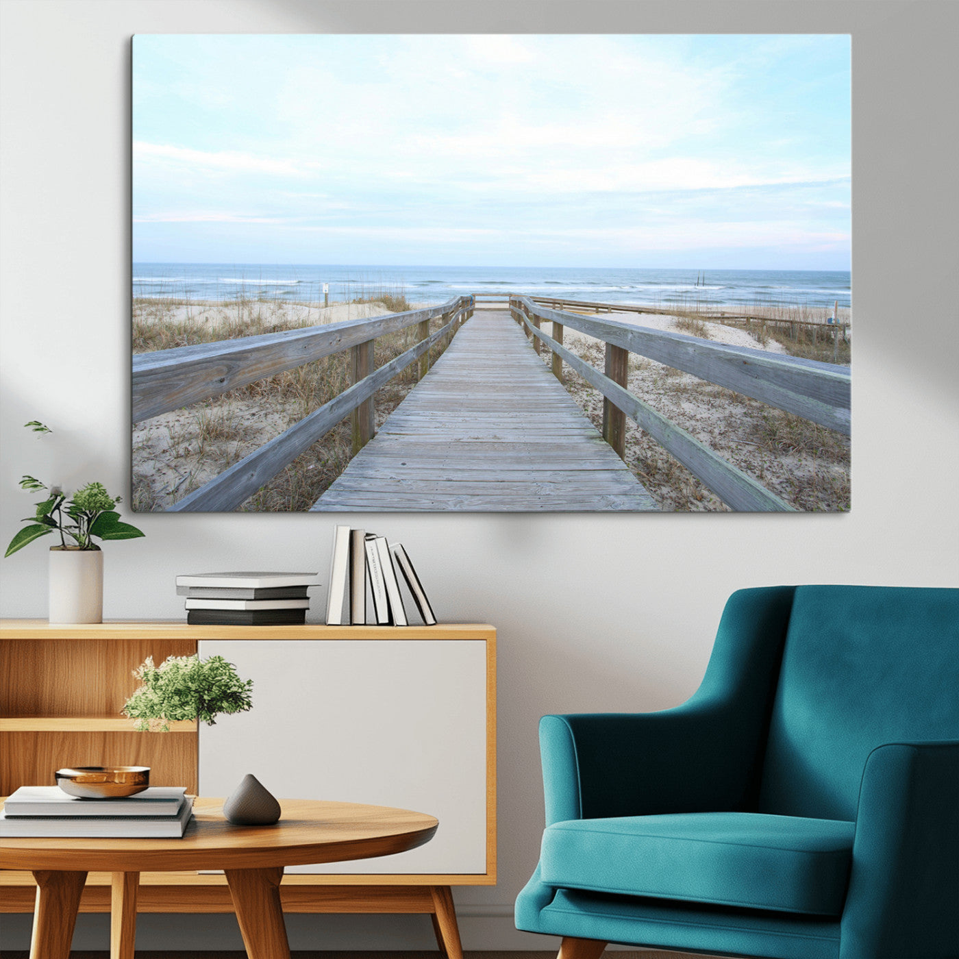 Wooden boardwalk leading to a peaceful beach with gentle ocean waves under a soft pastel sky, perfect for coastal and nautical home decor.