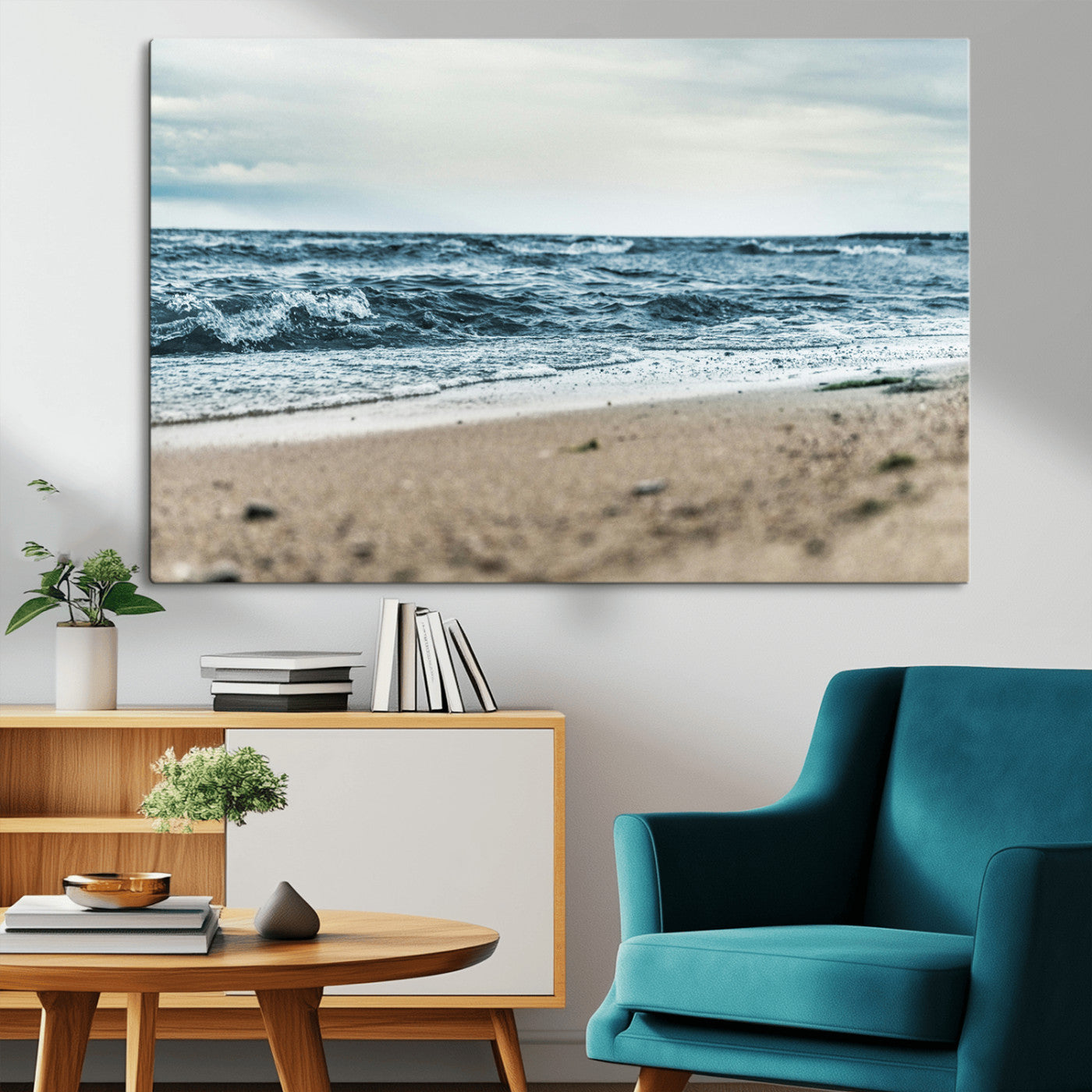A moody ocean scene with gentle waves washing onto a sandy beach under a cloudy sky, creating a peaceful and coastal atmosphere.