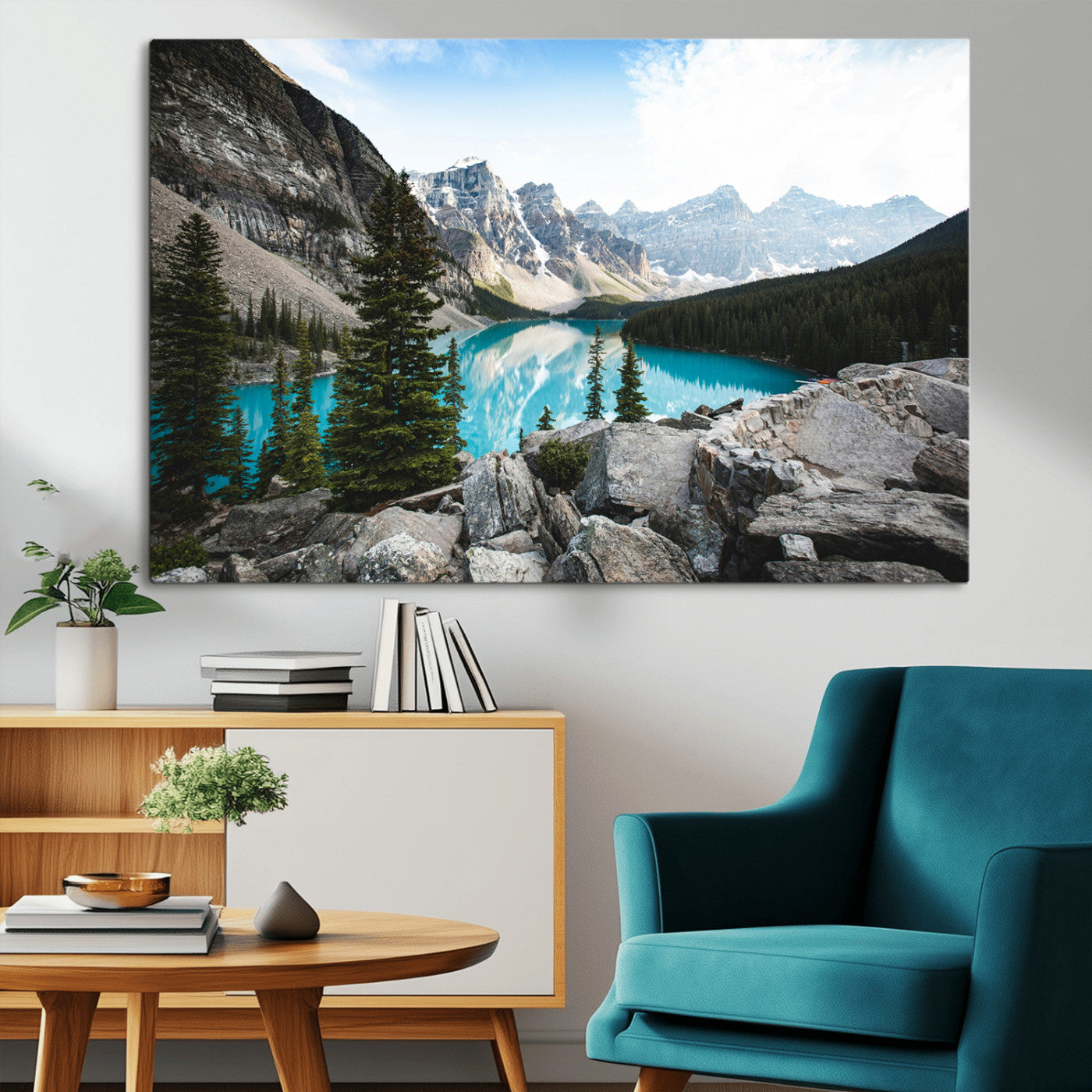 Stunning view of Moraine Lake with turquoise waters reflecting snow-capped mountains and evergreen trees, creating a peaceful alpine decor.